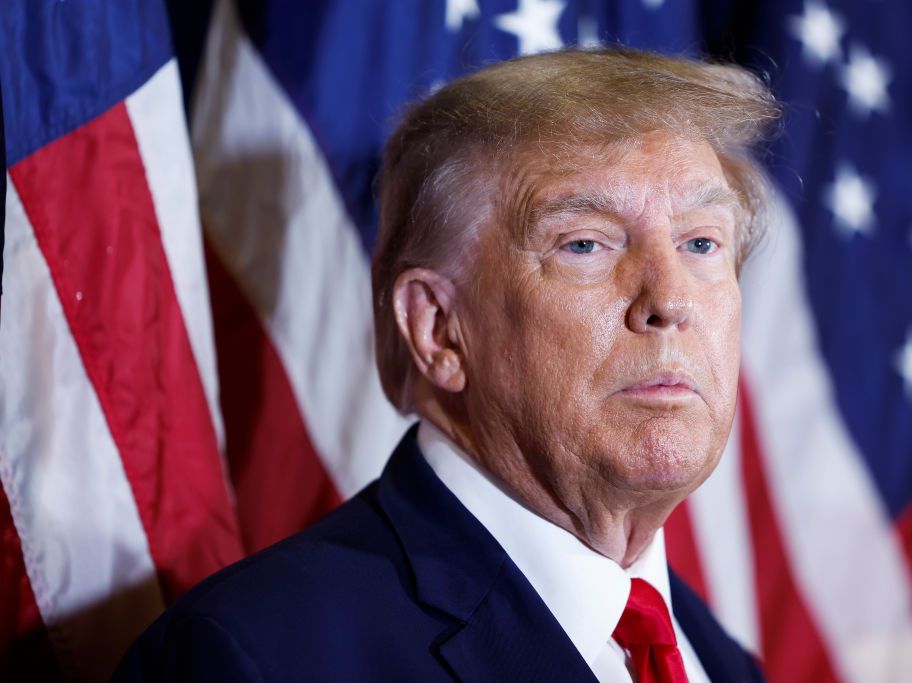 Trump Standing In Front of Flag